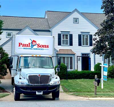 Paul and Sons parked moving van